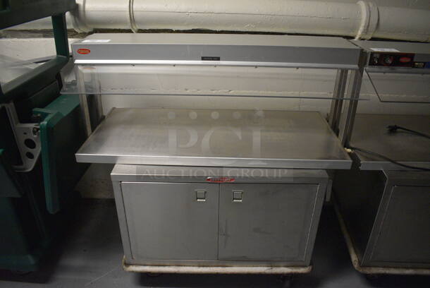 2 Units; Hatco Model GRBW-42 Metal Commercial Warming Shelf and Servolift Eastern Model P5-10-2 2 Door 2 Door Food Warmer on Commercial Casters. BUYER MUST REMOVE. 120 Volts, 1 Phase. 42x24x21, 32x24x21. 2 Times Your Bid! (Clearview Elementary - Lower Level)