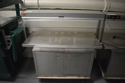 2 Units; Hatco Model GRBW-42 Metal Commercial Warming Shelf and Servolift Eastern Model P5-10-2 2 Door 2 Door Food Warmer on Commercial Casters. BUYER MUST REMOVE. 120 Volts, 1 Phase. 42x24x21, 32x24x21. 2 Times Your Bid! (Clearview Elementary - Lower Level)