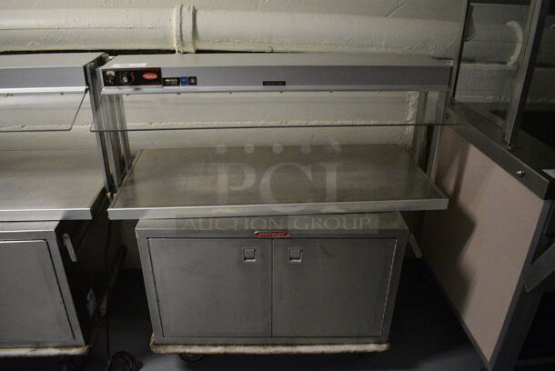 2 Units; Hatco Model GRBW-42 Metal Commercial Warming Shelf and Servolift Eastern Model P5-10-2 2 Door 2 Door Food Warmer on Commercial Casters. BUYER MUST REMOVE. 120 Volts, 1 Phase. 42x24x21, 32x24x21. 2 Times Your Bid! (Clearview Elementary - Lower Level)