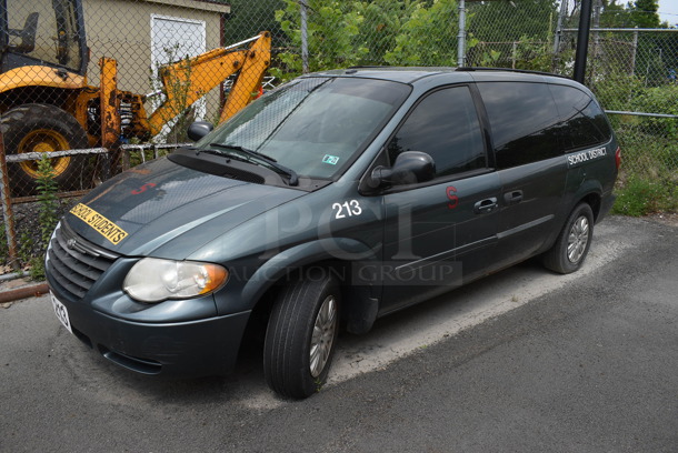 2007 Chrysler Town & Country Minivan w/o Second and Third Row Seating. Odometer Reads 174,828. VIN 2A4GP44R97R252043. Title In Hand. This Vehicle Was In Working Condition When Last Used But Has Been Sitting and Will Need It's Battery To Be Jumped. See Lot #8 For Additional Pictures. (Vehicle #213)
