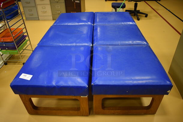 2 Blue 3 Section Cushioned Benches on Wood Pattern Frame. 72x25x18. 2 Times Your Bid! (Chipperfield Elementary Gym)