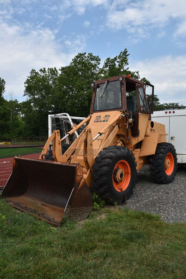 Case W14 Commercial Front Loader Tractor. This Vehicle Was In Working Condition When Last Used But Has Been Sitting and Will Need It's Battery To Be Jumped. See Lot #6 For Additional Pictures.