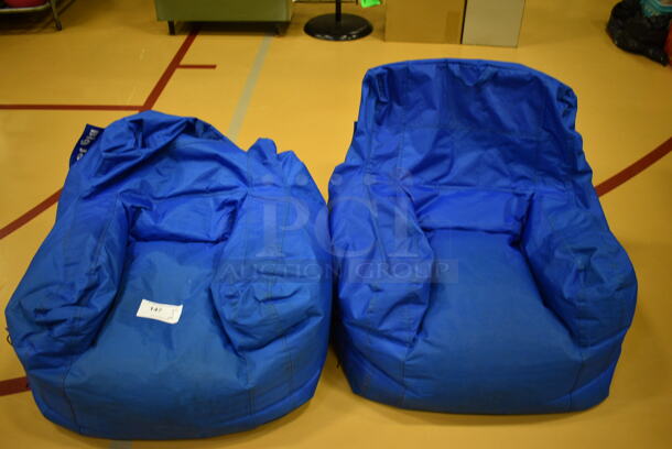 2 Blue Bean Bag Chairs. 28x27x24. 2 Times Your Bid! (Chipperfield Elementary Gym)