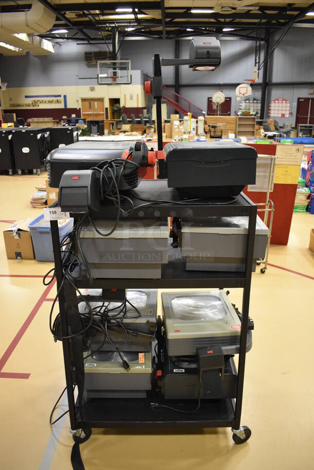 Black Metal 3 Tier AV Cart on Commercial Casters w/ 8 Various Overhead Projectors. 32.5x27.5x48. (Chipperfield Elementary Gym)