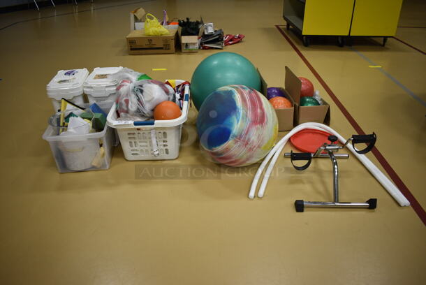 ALL ONE MONEY! Lot of Various Items Including 2 Balls, 4 Weighted Balls and Stationary Pedals. (Chipperfield Elementary Gym)