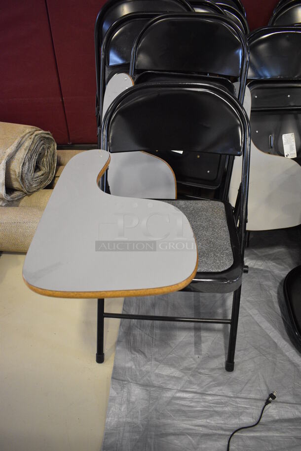 10 Black Metal Folding Chair w/ Attached Desktop. 21x26x30. 10 Times Your Bid! (Middle School Gym)
