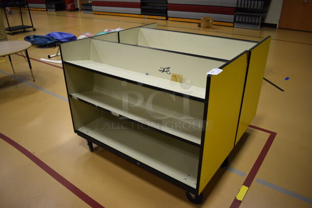 2 Yellow and White Portable Bookshelves on Commercial Casters. 48x24x37.5. 2 Times Your Bid! (Chipperfield Elementary Gym)