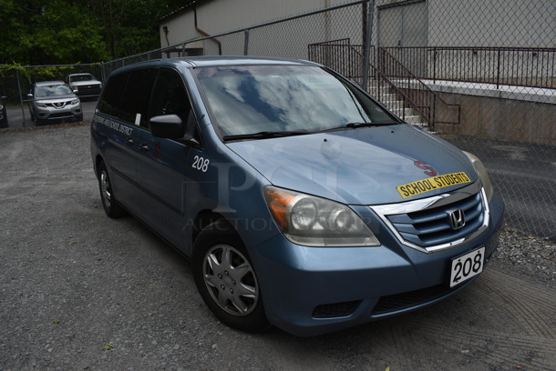 2009 Honda Odyssey Minivan w/o Back Row Seating. Odometer Reads 198,942. VIN 5FNRL38269B057355. Title In Hand. This Vehicle Was In Working Condition When Last Used But Has Been Sitting and Will Need It's Battery To Be Jumped. See Lot #12 For Additional Pictures. (Vehicle #208)