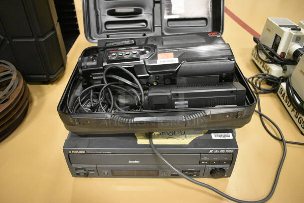 3 Various Items; Panasonic VHS Movie Camera, Pioneer Model CLD-V2600 CD CDV LD Player and InFocus PC Viewer. 3 Times Your Bid! (Chipperfield Elementary Gym)