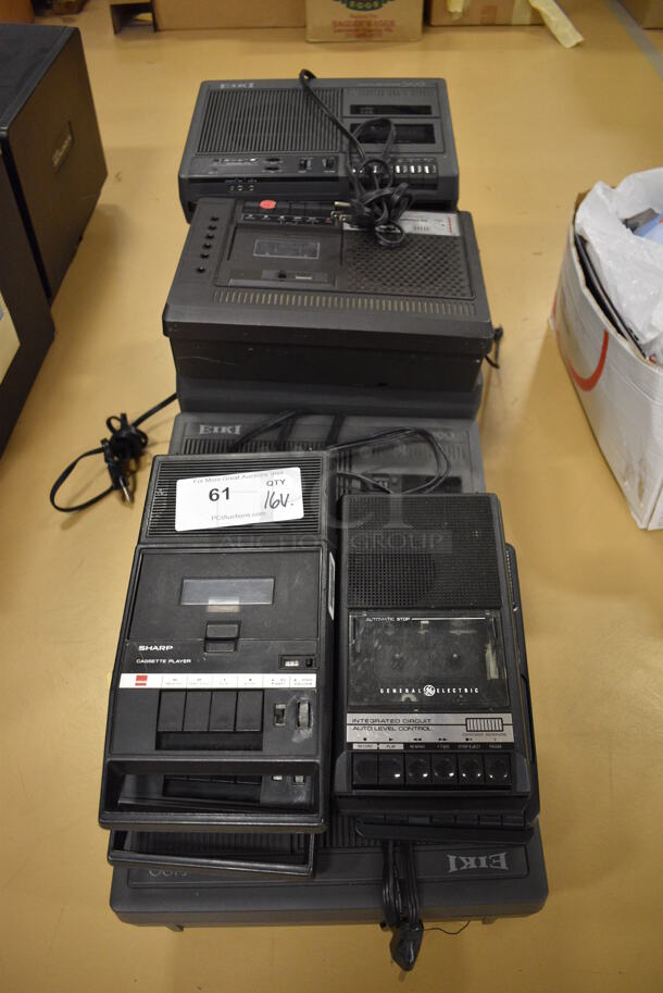 16 Various Cassette Players Including Sharp, General Electric and Eiki. Includes 13x10x4. 16 Times Your Bid! (Chipperfield Elementary Gym)