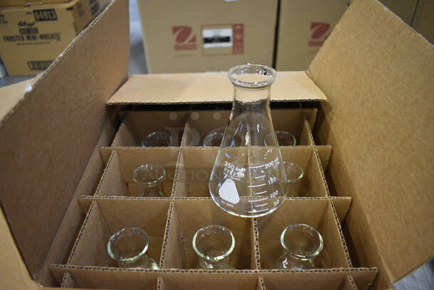 8 Boxes of Various Beakers. Total of Approximately 78. Includes 3x3x5.5. 8 Times Your Bid! (Middle School Gym)