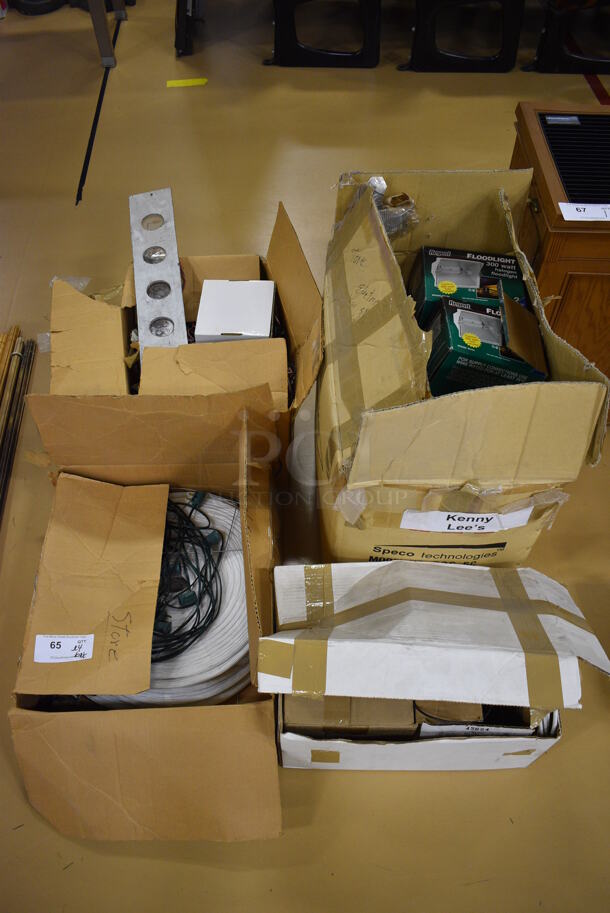 ALL ONE MONEY! Lot of 4 Boxes of Various Items Including Wires and Regent Floodlights. (Chipperfield Elementary Gym)