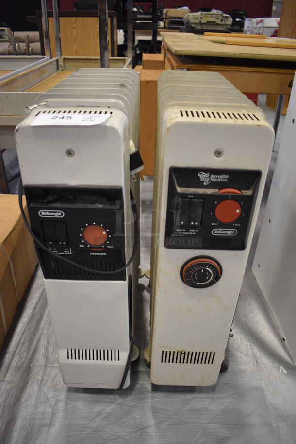 2 Various DeLonghi Metal Floor Style Heater. 17x6x26. 2 Times Your Bid! (Middle School Gym)