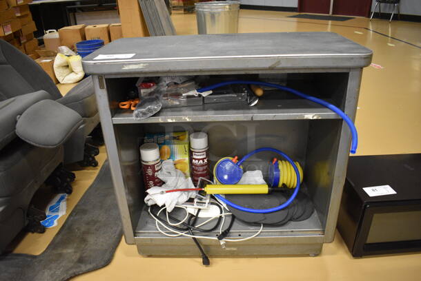 Gray Metal Counter w/ Contents. 30x15x29.5. (Chipperfield Elementary Gym)