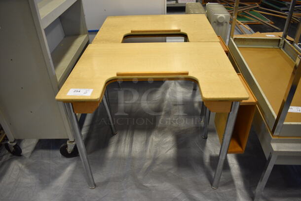2 Wood Pattern Desks on Metal Legs. 34.5x23.5x27. 2 Times Your Bid! (Middle School Gym)
