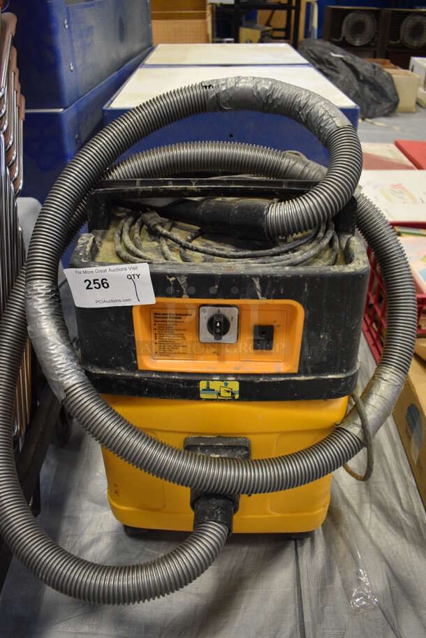 Yellow and Black Wet Dry Vacuum Cleaner. 15x15x24. (Middle School Gym)