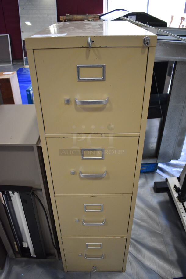 Tan Metal 4 Drawer Filing Cabinet. 15x27x52. (Middle School Gym)