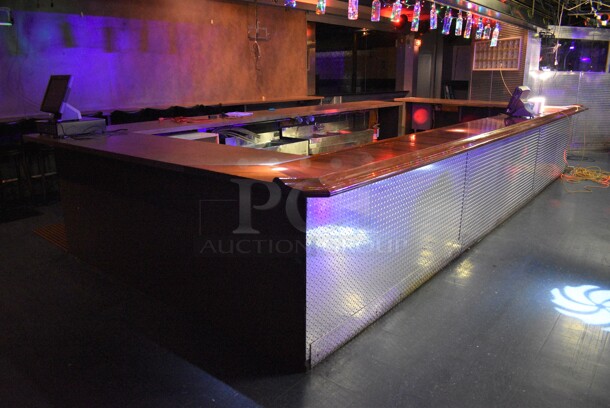Bar w/ Some Brazilian Cherry Wood Bar Top and Diamond Plate Panels. BUYER MUST REMOVE. 120x276x43. (upstairs)