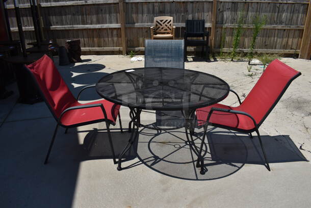 Black Mesh Metal Patio Table w/ 3 Patio Chairs; 2 Red and 1 Blue. 48x48x28, 25x30x37. (patio)