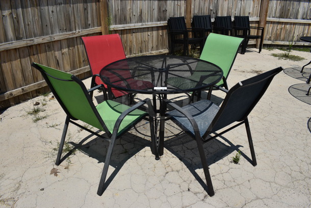 Black Mesh Metal Patio Table w/ 4 Patio Chairs; 2 Green, 1 Red and 1 Blue. 48x48x28, 25x30x37. (patio) - Image 1 of 4