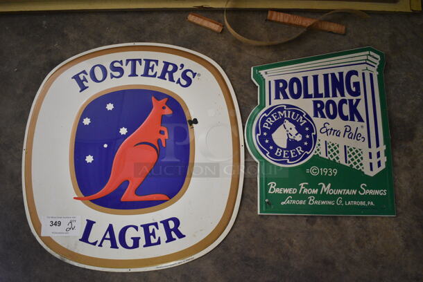2 Various Metal Signs; Fosters and Rolling Rock. 16x19, 23.5x23.5. 2 Times Your Bid! (basement)