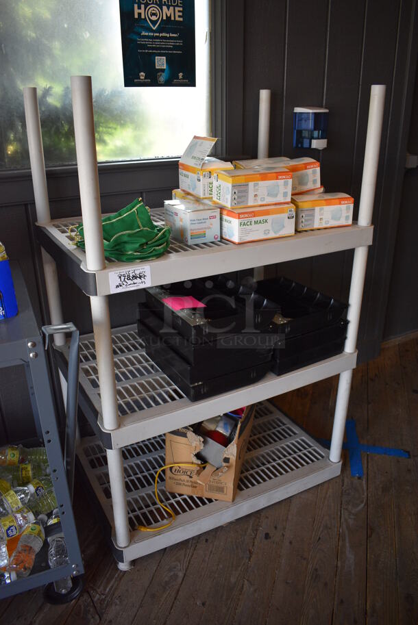 Tan Poly 3 Tier Shelving Unit w/ Contents Including Masks and Cash Drawer Inserts. BUYER MUST DISMANTLE. PCI CANNOT DISMANTLE FOR SHIPPING. PLEASE CONSIDER FREIGHT CHARGES. 36x24x54. (vestibule)