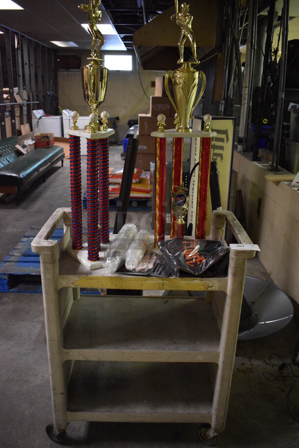 Tan Poly 3 Tier Cart w/ 2 Trophies and Jagermeister Items. 31x18x37.5. (basement)  - Image 1 of 5