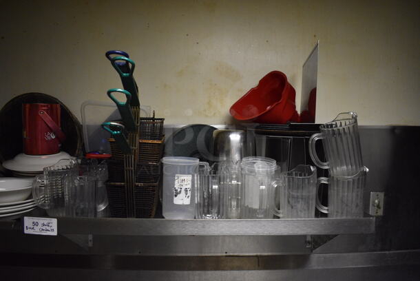 Stainless Steel Wall Mount Shelf w/ Contents Including Metal Fry Baskets and Poly Pitchers. BUYER MUST REMOVE. 42x22x12. (dishwasher area) - Image 1 of 6