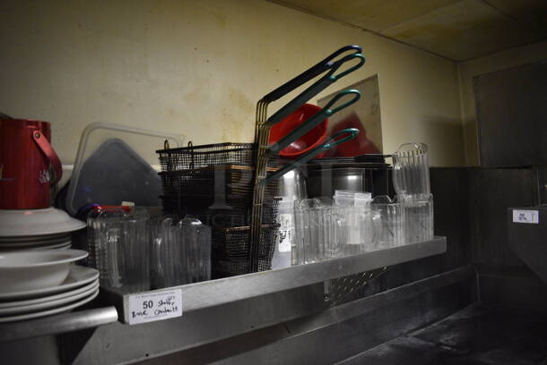 Stainless Steel Wall Mount Shelf w/ Contents Including Metal Fry Baskets and Poly Pitchers. BUYER MUST REMOVE. 42x22x12. (dishwasher area) - Image 2 of 6