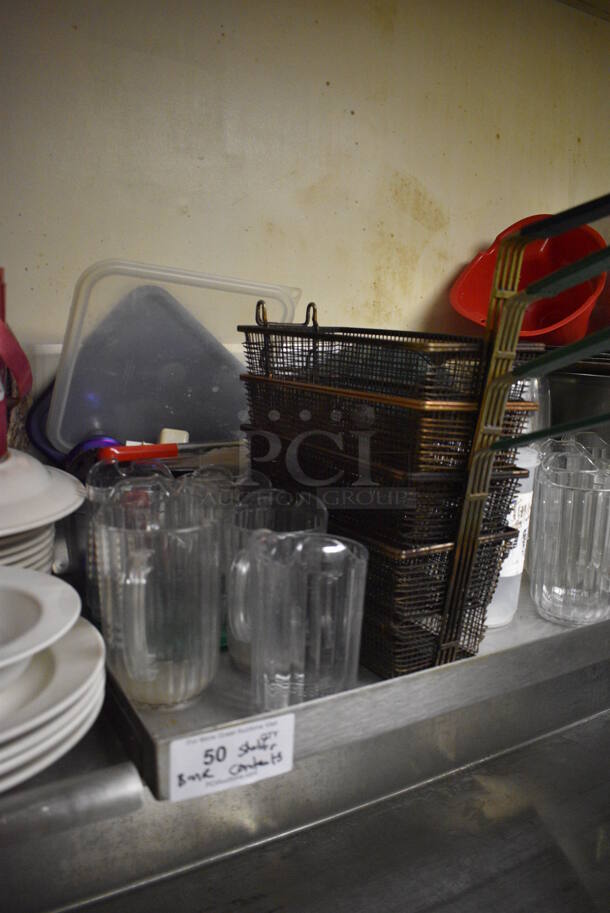 Stainless Steel Wall Mount Shelf w/ Contents Including Metal Fry Baskets and Poly Pitchers. BUYER MUST REMOVE. 42x22x12. (dishwasher area) - Image 3 of 6