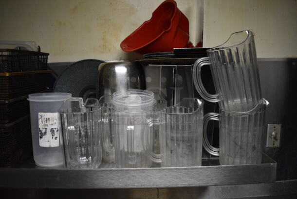 Stainless Steel Wall Mount Shelf w/ Contents Including Metal Fry Baskets and Poly Pitchers. BUYER MUST REMOVE. 42x22x12. (dishwasher area) - Image 4 of 6