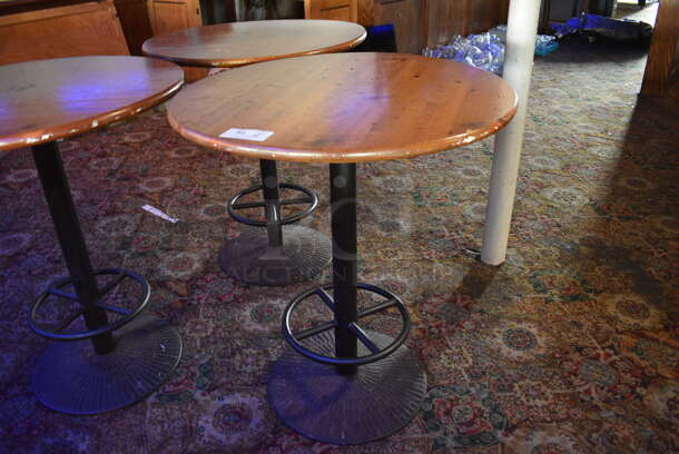 3 Round Wood Pattern Bar Height Tables on Metal Table Base. 36x36x42. 3 Times Your Bid! (bar)