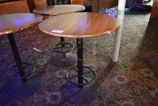 3 Round Wood Pattern Bar Height Tables on Metal Table Base. 36x36x42. 3 Times Your Bid! (bar) - Image 1 of 6