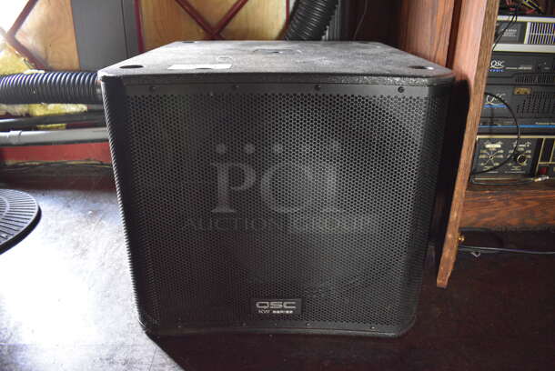 QSC KW Series Speaker on Commercial Casters. 24x28x20.5. (bar)