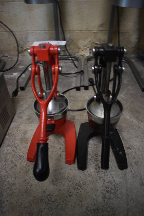 2 Metal Countertop Manual Juicers; Red and Black. 7x11x16. 2 Times Your Bid! (basement)
