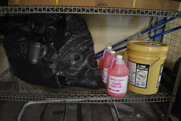 ALL ONE MONEY! Lot of Metal 4 Tier Shelving Unit w/ Contents Including Foaming Hand Soap Jugs and Glassware. BUYER MUST DISMANTLE. PCI CANNOT DISMANTLE FOR SHIPPING. PLEASE CONSIDER FREIGHT CHARGES. 54x18x35. BUYER MUST REMOVE. (basement) - Image 3 of 5