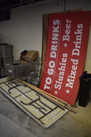 ALL ONE MONEY! Lot of Shopping Cart w/ Contents, Folding Table and Signs. BUYER MUST REMOVE. (basement)