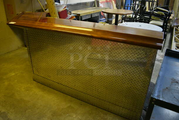 L Shaped Bar w/ Brazilian Cherry Wood Bar Top and Diamond Plate Panels. BUYER MUST REMOVE. 104x24x45. (basement)
