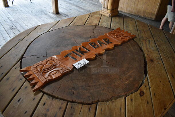 Wooden Tiki Bar Sign. Buyer Can Also Take Wooden Tabletop Around Stump If They Want To; That Is BUYER MUST REMOVE. 40x1x7.5, 50x63. (patio) - Image 2 of 6