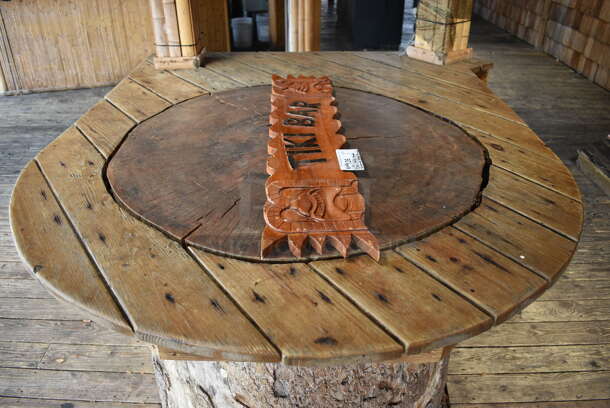 Wooden Tiki Bar Sign. Buyer Can Also Take Wooden Tabletop Around Stump If They Want To; That Is BUYER MUST REMOVE. 40x1x7.5, 50x63. (patio) - Image 5 of 6