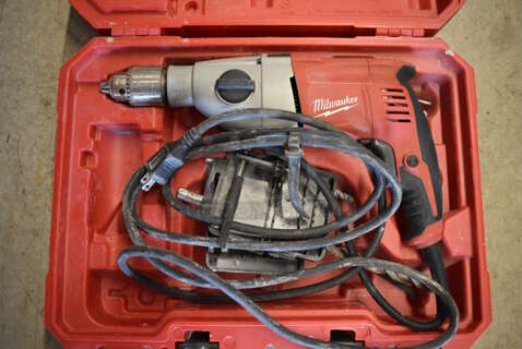 Milwaukee 1/2" Hammer Drill in Red Hard Case. 17x5x13.5