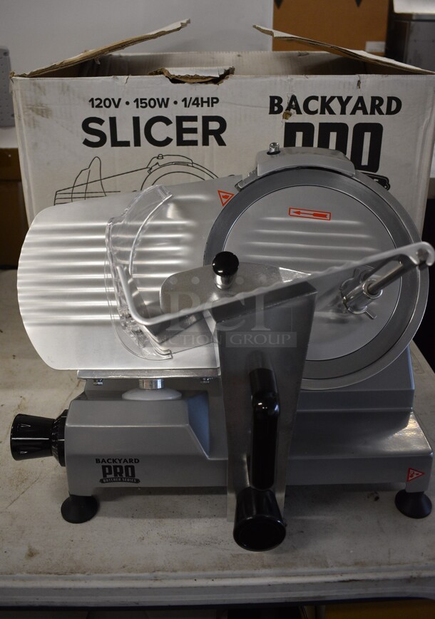 BRAND NEW IN BOX! Backyard Pro MS-106115A Stainless Steel Commercial Countertop Meat Slicer w/ Blade Sharpener. 120 Volts, 1 Phase. 21x18x17. Tested and Working!