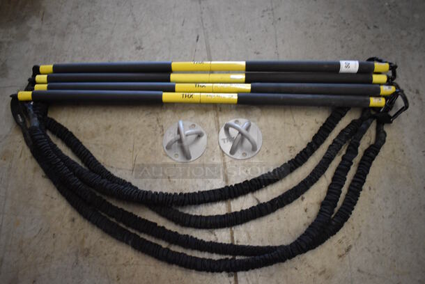 4 TRX Yellow and Black Rip Trainers w/ 2 Gray Wall Mounts. 42