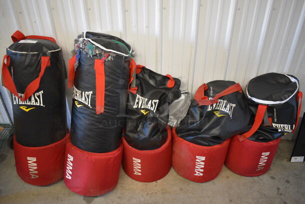 5 Everlast Red and Black Punching Bags. See Pictures for Condition. 15x15x36. 5 Times Your Bid!
