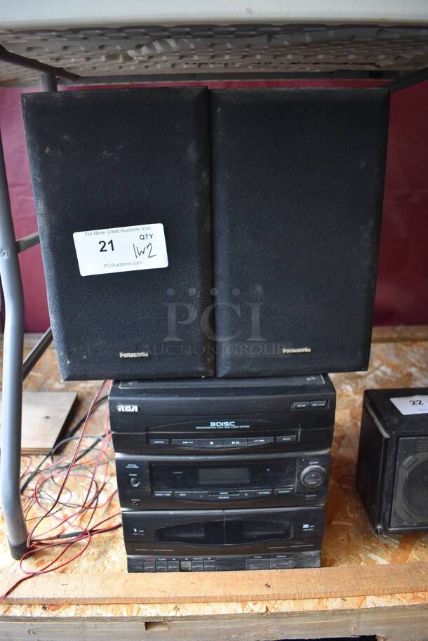 RCA 3 Disc Simultaneous Play and Load Stereo System w/ 2 Panasonic Speakers. 11x13x11.5, 8x7.5x13.5