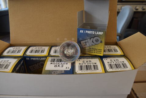 ALL ONE MONEY! Lot of 12 Boxes of Eiko AV Photo Lamp Bulbs. 4 Boxes of EXR, 2 Boxes of ENX, 5 Boxes of FXL, 1 Box of ELH