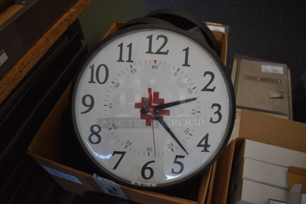 ALL ONE MONEY! Lot of 2 Boxes of PrimeX Clocks w/ HACC Logo. These clocks have the ability to be hooked up to an atomic clock in Colorado if you pay for a subscription, get a receiver and GPS antenna. If you don't do that, you can press the red button and that changes the clock to being battery powered. Approximately 20 Clocks. 12.5x2.5x12.5 - Image 2 of 8