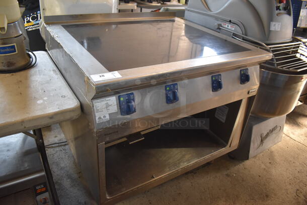 2013 Electrolux 584132 Stainless Steel Commercial Floor Style Electric Powered 4 Burner Range w/ Under Shelf. 208 Volts, 3 Phase. 40x36x38 - Image 1 of 9