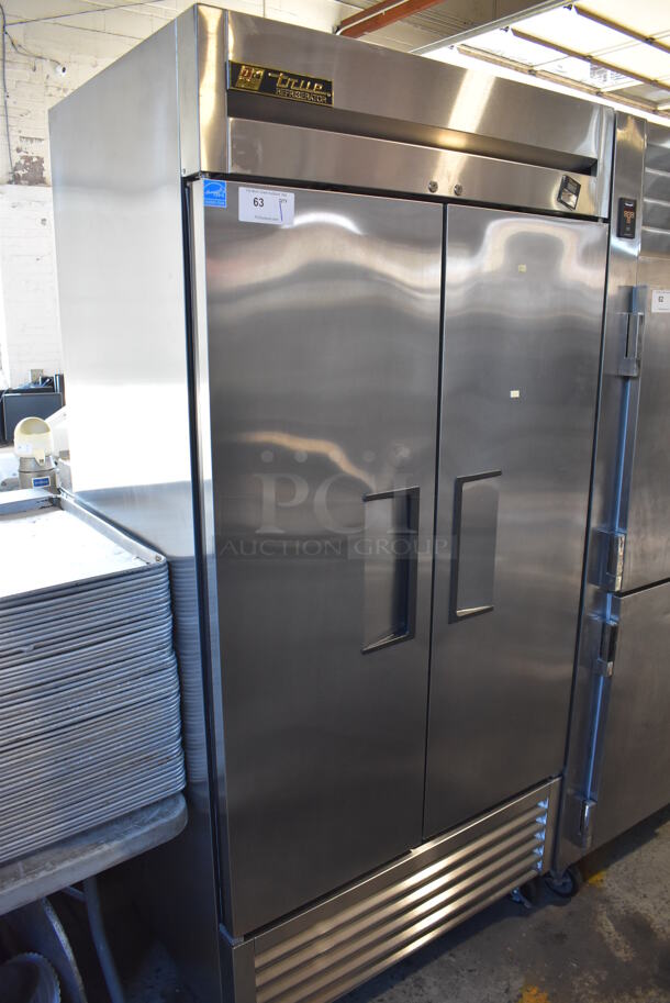 2014 True TS-35 ENERGY STAR Stainless Steel Commercial 2 Door Reach In Cooler w/ Poly Coated Racks on Commercial Casters. 115 Volts, 1 Phase. 39.5x30x83. Tested and Working!