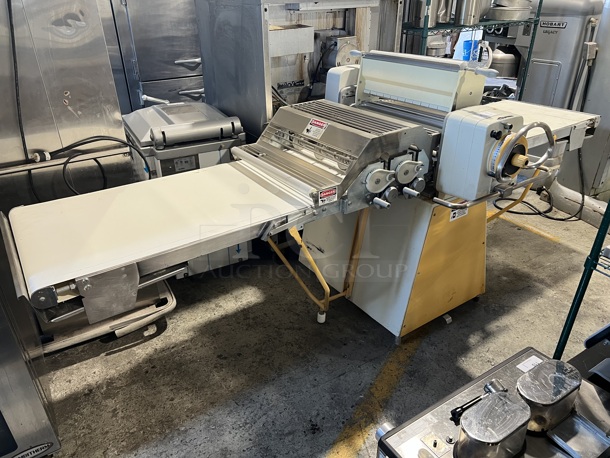 Rondo Seewer SSO 68 C Metal Commercial Floor Style Reversible Dough Sheeter w/ Cutting Station and 2 Cutters on Commercial Casters. 220 Volts, 1 Phase. 128x47x54